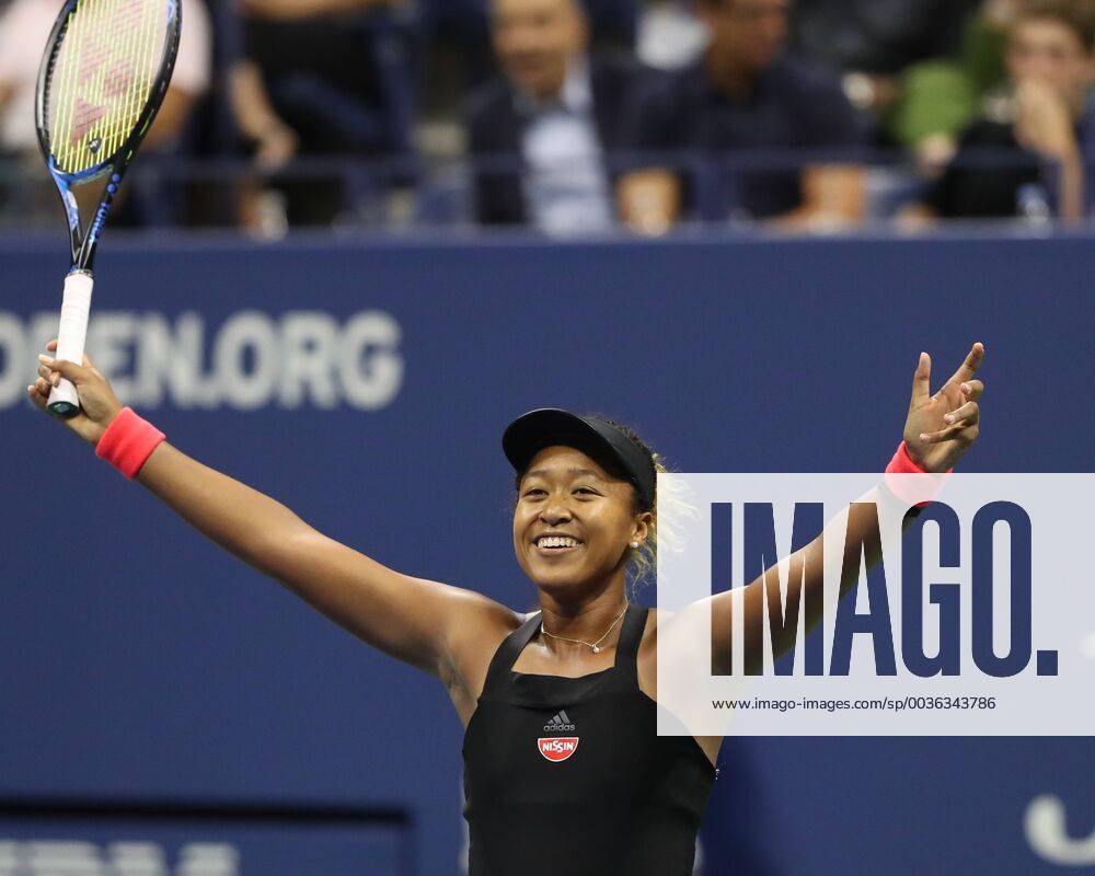 Naomi Osaka reaches up and cheers joy cheering emotion