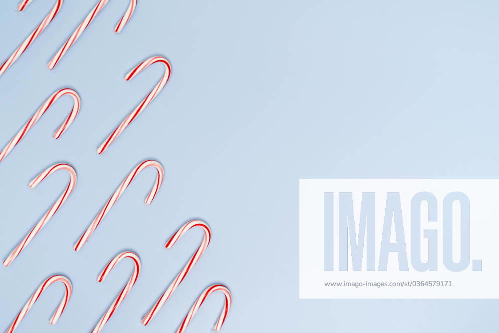 Candy Canes on Blue Background with Copy on the Right Jersey City, New Jersey, United States R_OBVP23111427-1287114-01