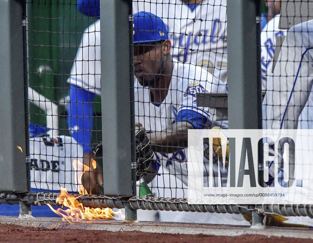 Kansas City, MO, USA - Kansas City Royals third baseman Alcides Escobar tried to use his glove to put out a small fire in the dugout before the start of a game against the Minnesota Twins on Friday, Sept. 14, 2018, at Kauffman Stadium in Kansas City, Mo. Minnesota at Kansas City - ZUMAm67_ 20180914_zaf_m67_018