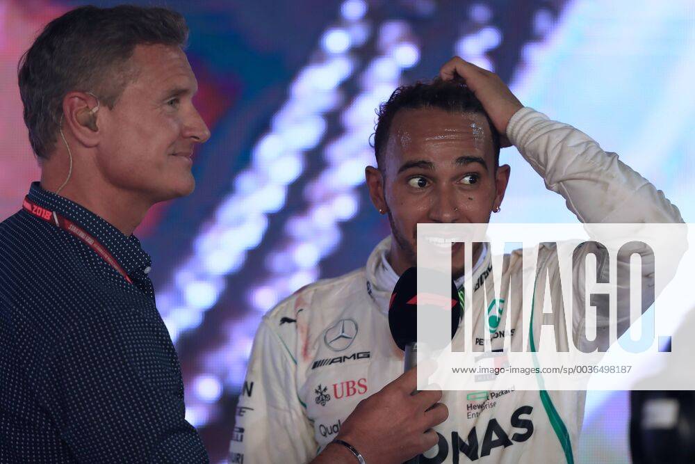 16th September 2018, Marina Bay Street Circuit, Singapore; Formula One Grand Prix of Singapore, race day; Mercedes AMG Petronas Motorsport, Lewis Hamilton wins in Singapore and talks with David Coulthard on the podium ActionPlus12063176 Octane