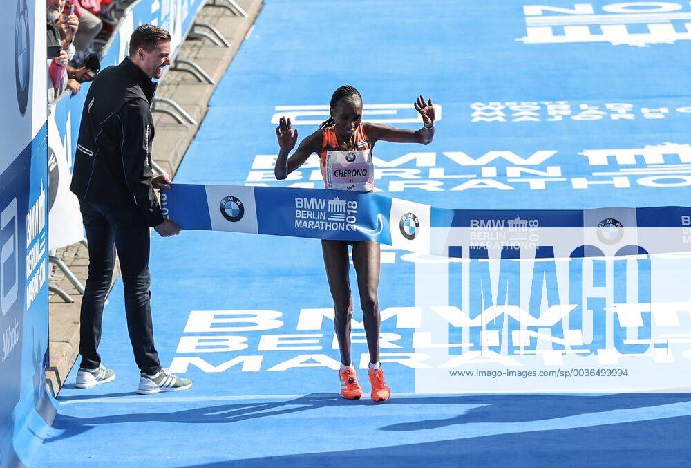 (180916) -- BERLIN, Sept. 16, 2018 -- Kenya s Gladys Cherono (R) crosses the finishing line during the Berlin Marathon 2018 in Berlin, capital of Germany, on Sept. 16, 2018. The Berlin Marathon 2018 kicked off in Berlin on Sunday. Eliud Kipchoge from Kenya won the men s title with a new world record of 2:01:39. Women s title fell on Kenya s Gladys Cherono with a result of 2:18:11. ) (SP)GERNAMY-BERLIN-BERLIN MARATHON 2018 ShanxYuqi