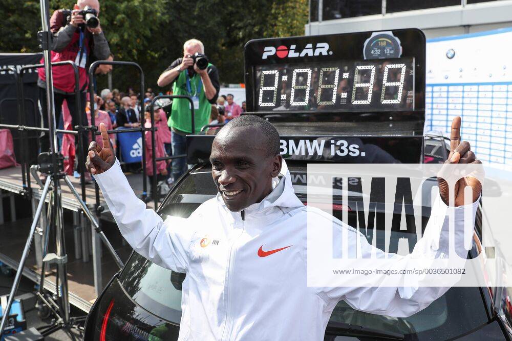 (180916) -- BERLIN, Sept. 16, 2018 -- Kenya s Eliud Kipchoge poses for photos with the vehicle displaying his new world record during the Berlin Marathon 2018 in Berlin, capital of Germany, on Sept. 16, 2018. The Berlin Marathon 2018 kicked off in Berlin on Sunday. Eliud Kipchoge from Kenya won the men s title with a new world record of 2:01:39. Women s title fell on Kenya s Gladys Cherono with a result of 2:18:11. ) (SP)GERNAMY-BERLIN-BERLIN MARATHON 2018 ShanxYuqi
