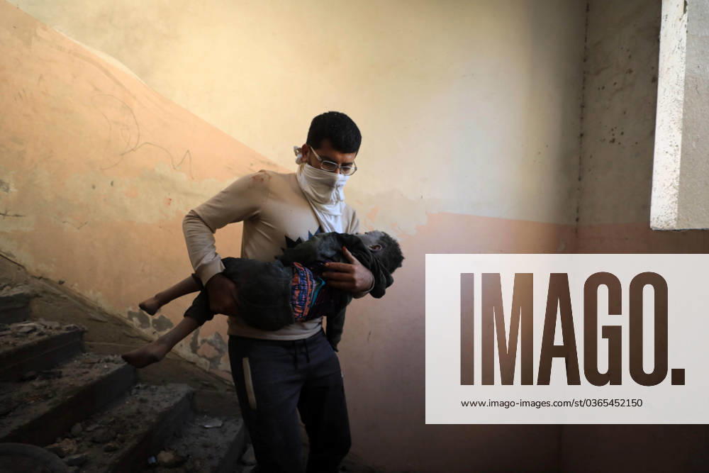 KW46 (231118) -- GAZA, Nov. 18, 2023 -- A man evacuates the injured from the rubble of a building destroyed in an Israeli military operation in the southern Gaza Strip city of Khan Younis Nov. 17, 2023. Gaza s government media office announced on Friday that the total number of Palestinian deaths in the enclave has exceeded 12,000 since the start of the Israel-Hamas conflict on Oct. 7. (Photo by Xinhua) MIDEAST-GAZA-PALESTINIAN-ISRAELI CONFLICT YasserxQudih