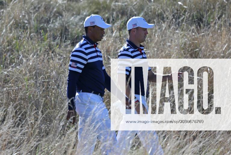 Tiger Woods (L) and Justin Thomas walk to the 14th green during a Ryder Cup 2018 practice session at Le Golf National in Guyancourt near Paris on September 26, 2018. The three-day tournament features Team USA versus Team Europe and starts Friday, September 28th. PAR20180926062 DAVIDxSILPA