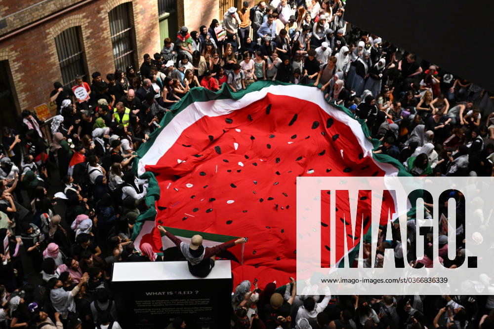 KW47 PRO PALESTINE STUDENT RALLY MELBOURNE, Protesters gather inside of Melbourne Central during a Pro-Palestine demonstration in Melbourne, Thursday, November 23, 2023. ( NO ARCHIVING, , NO USE IN BOOKS WITHOUT CONSENT MELBOURNE VICTORIA AUSTRALIA