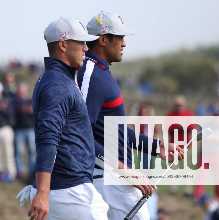 Brooks Koepka (L) and Tony Finau walks between holes on day one of the Ryder Cup at Le Golf National in Guyancourt near Paris on September 28, 2018. Team USA leads Team Europe 3-1 after completion of the opening four-balls. PAR20180928121 DAVIDxSILPA