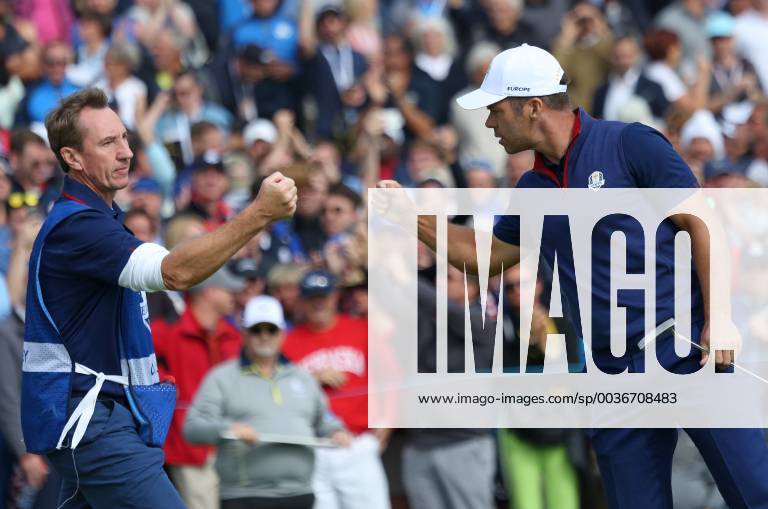 Paul Casey fist bumps his caddy after making a shot on day one of the Ryder Cup at Le Golf National in Guyancourt near Paris on September 28, 2018. Team USA leads Team Europe 3-1 after completion of the opening four-balls. PAR20180928108 DAVIDxSILPA