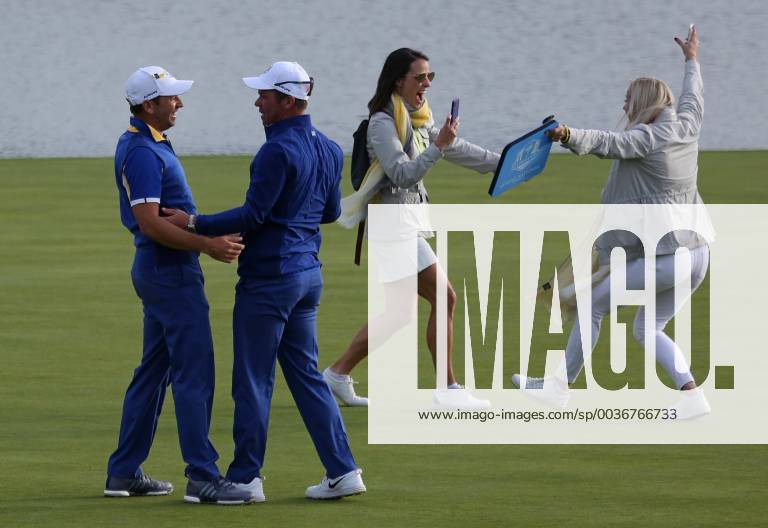 Sergio Garcia (L), Paul Casey and their wives celebrate after Team Europe clinches the Ryder Cup at Le Golf National in Guyancourt near Paris on September 30, 2018. Team Europe defeated Team USA 17.5 to 10.5 to hand the Americans their sixth straight loss on foreign soil. PAR201809300543 DAVIDxSILPA