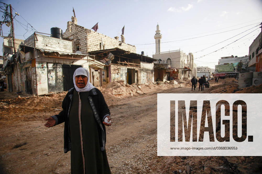 A view of damaged vehicle as buildings, vehicles and streets are heavily damaged after Israeli forces carried A view of damaged vehicle as buildings, vehicles and streets are heavily damaged after Israeli forces carried out airstrikes with armed unmanned aerial vehicles (UAVs) on Jenin refugee camp in Jenin, West Bank on November 26, 2023. Photo by Mohammed Nasser apaimages Jenin West Bank Palestinian Territory 261123_Jenin_MN_00(2)