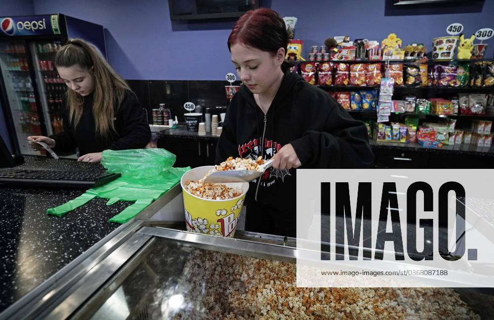 Russia Ukraine Military Operation Daily Life 8566896 25.11.2023 Young women sell popcorn at the snack bar of the Savona cinema in Mariupol, Donetsk People s Republic, Russia. The first cinema after the city s liberation opened on October 5th after restoration. Alexandr Suhov Sputnik Mariupol Donetsk People s Republic Russia
