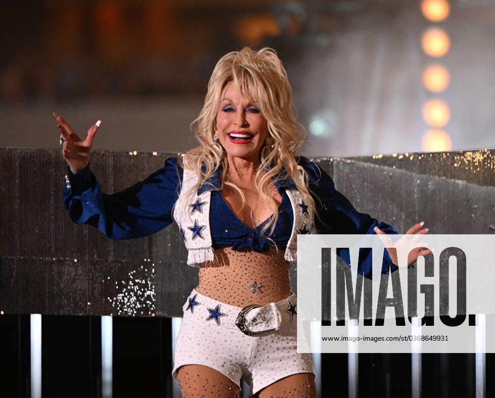 Dolly Parton performs at the 27th annual Red Kettle Kickoff during halftime of the Dallas Cowboys and Washington Commanders game at AT&T Stadium in Arlington, Texas, on Thursday, November 23, 2023. Since teaming up in 1997, The Salvation Army and the Cowboys have helped raise more than $3 billion for those in need. POY2023S002 IANxHALPERIN