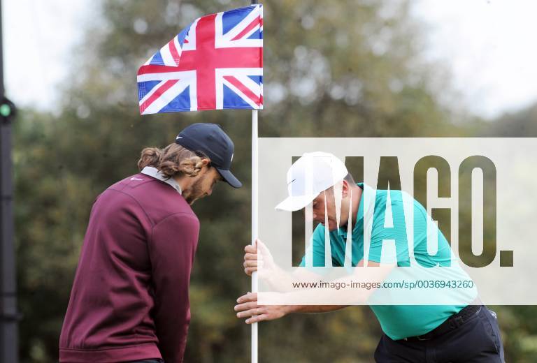 Golf - 2018 Sky Sports British Masters - Thursday, First Round Flying the Flag - Francesco Molinari of Italy adjusts the flag for Tommy Fleetwood of England, at Walton Heath Golf Club. COLORSPORT ANDREW COWIE