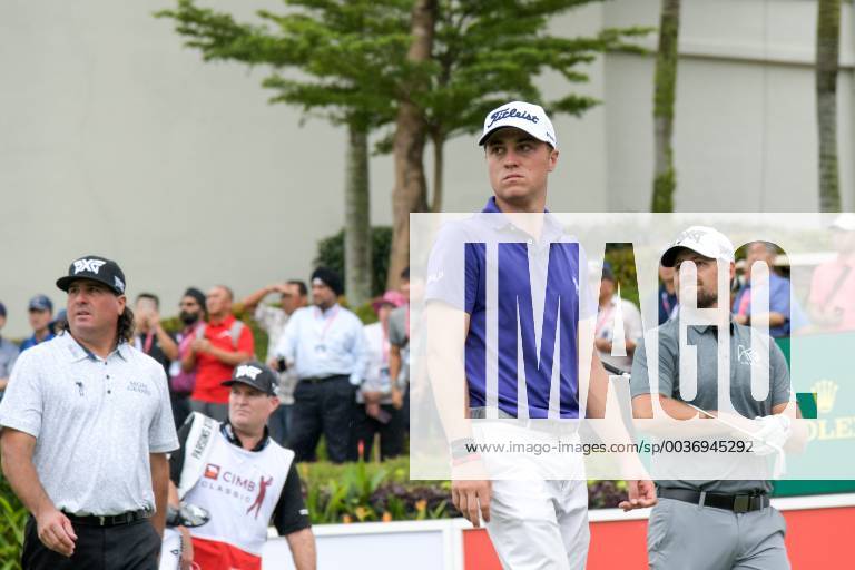 Kuala Lumpur, Malaysia - Justin Thomas(C), Pat Perez(L) Ryan Moore(R) of the United States in action on first round of the CIMB Classic at TPC Kuala Lumpur on 11 October, 2018 in Kuala Lumpur, Malaysia CIMB Classic - Round One - ZUMAn230 20181011_zaa_n230_138