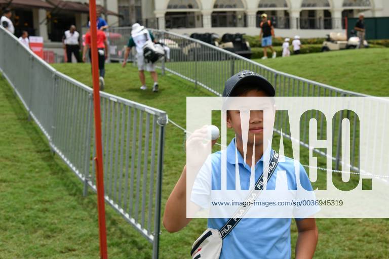 Kuala Lumpur, Malaysia - A boy holds a ball given by Marc Leishman of Australia during the first round of the CIMB Classic at TPC Kuala Lumpur on 11 October, 2018 in Kuala Lumpur, Malaysia CIMB Classic - Round One - ZUMAn230 20181011_zaa_n230_139