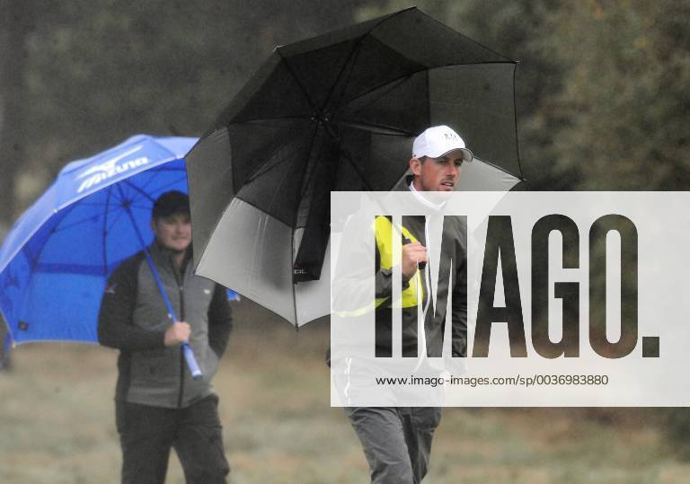 Golf - 2018 Sky Sports British Masters - Sunday, Fourth Round Alexander Bjork of Sweden under the umbrella, at Walton Heath Golf Club. COLORSPORT ANDREW COWIE