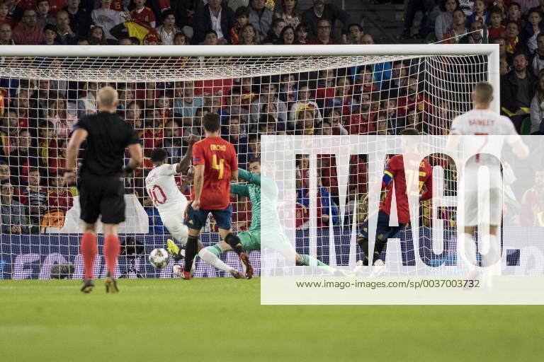 Seville, Spain - RAHEEM STERLING of England (L ) scores for 3-0 during the UEFA Nations League Group A4 soccer match between Spain and England at the Benito Villamarin Stadium Soccer 2018 - Spain vs England - ZUMAa142 20181015_zap_a142_012