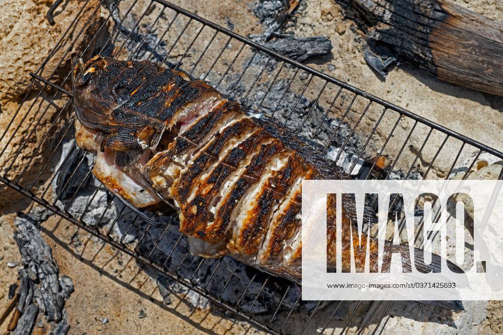 Fresh fish Fish, grilled at a simple Grill on Beach of Fishing villages Andavadoaka at Morombe, Region Atsimo Andrefana, Madagascar, Africa