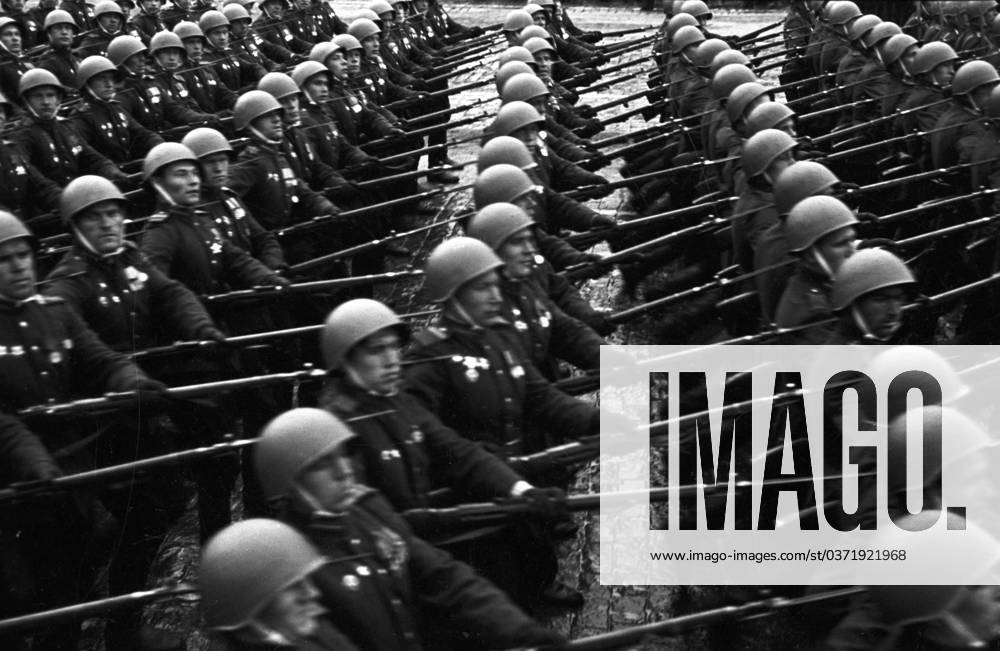 Victory parade on Red Square 5812038 24.06.1945 Victory parade on Red Square. June 24, 1945. Carrying German standards to the foot of the Lenin Mausoleum. Loskutov Moscow Russia