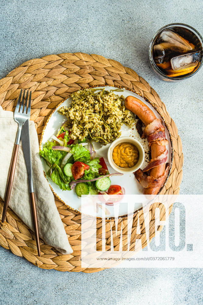 Vegetables and sausages on plate served with glass of cola drink Model Released AnnaBogush_ID13332_406664_003