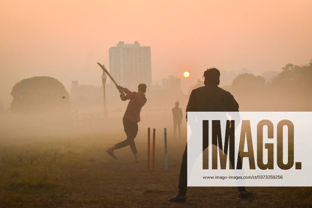 Winter In Kolkata, India People are playing cricket on a foggy winter morning inside a ground in Kolkata, India, on December 10, 2023. Kolkata India