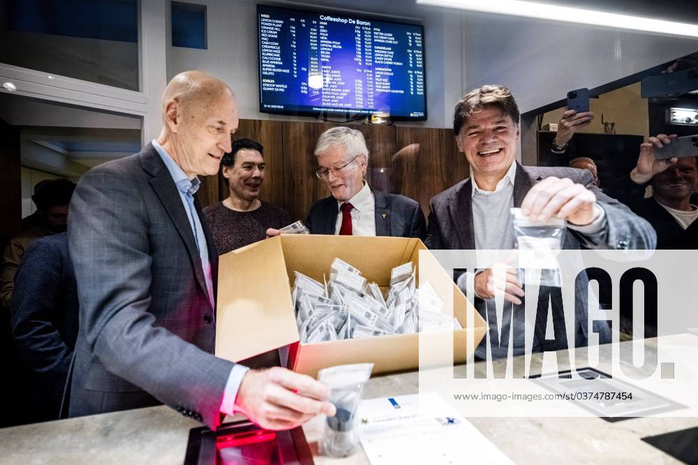 BREDA - Outgoing Minister Ernst Kuipers with mayors of Tilburg Theo Weterings and Paul Depla of Breda scan a box with regulated cannabis in coffee shop De Baron. This marks the start of the closed coffee shop chain experiment. ANP ROB ENGELAAR netherlands out - belgium out