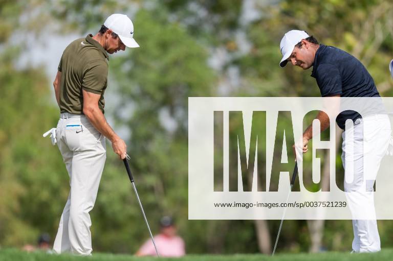 Rory Mcilroy of Northern Ireland (left) and Patrick Reed of the USA (right) look at the same spot on the green in round 2 during the DP World Tour Championship at Jumeirah Golf Estates, Dubai, UAE on 16 November 2018.