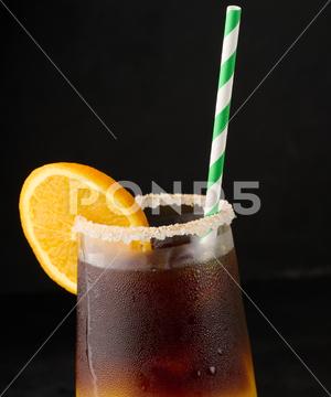 Iced coffee with orange juice in a transparent glass, refreshing bumble coffee on the table layer coffee orange brown sweet cool ice espresso cold drink glass fresh juice beverage cocktail morning caffeine fruit syrup table yellow citrus juicy bumble slice nobody black