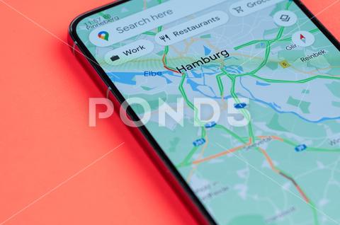 Making best route through traffic jam in Hamburg on smartphone screen close up view with red background hamburg germany europe eu map google street car travel application technology mobile direction destination device phone gps app communication road navigation screen smartphone location internet global city transport traffic display search illustrative driver route jam navigator information way popular update view assistant driving traffic jam cellphone service editorial cellular