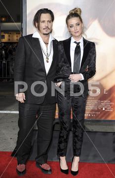 Johnny Depp and Amber Heard at the Los Angeles premiere of 'The Danish Girl' held at the Westwood Village Theatre in Westwood, USA on November 21, 2015. actor actress celebrity talent actors actresses entertainment cinema red carpet premiere movie star celebrities fashion hollywood famous fame popular movies film success dress artist california event attractive