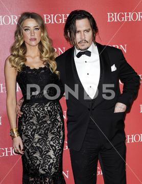 Amber Heard and Johnny Depp at the 27th Annual Palm Springs International Film Festival Awards Gala held at the Palm Springs Convention Center in Palm Springs, USA on January 2, 2016. actor actress celebrity talent actors actresses entertainment cinema red carpet premiere movie star celebrities fashion hollywood famous fame popular movies film success dress artist california event attractive