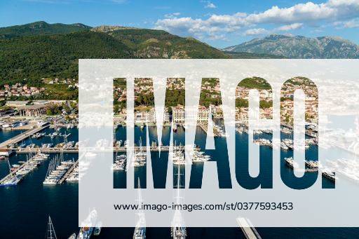 A high angle shot of boats near the dock with buildings on the shore in Porto Montenegro, Kotor, Montenegro 144931 RECORD DATE NOT STATED