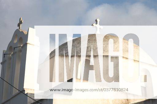 A low angle shot of an old chapel touching the cloudy sky in the Greek island of Folegandros 149301 RECORD DATE NOT STATED