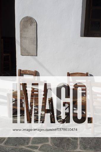 A traditional small cafe in the old twn on the beautiful and remote Greek island of Folegandros. Tables and chairs at the entrance. 386394 RECORD DATE NOT STATED