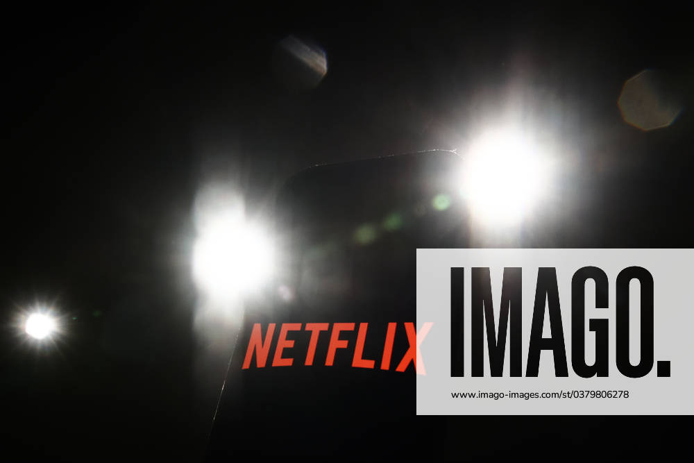 Popular Apps And IT Companies Photo Illustrations Lights and Netflix logo displayed on a phone screen are seen in this illustration photo taken in Krakow, Poland on December 27, 2023. Krakow Poland
