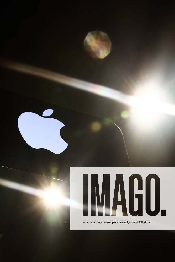 Popular Apps And IT Companies Photo Illustrations Lights and Apple logo displayed on a phone screen are seen in this illustration photo taken in Krakow, Poland on December 27, 2023. Krakow Poland
