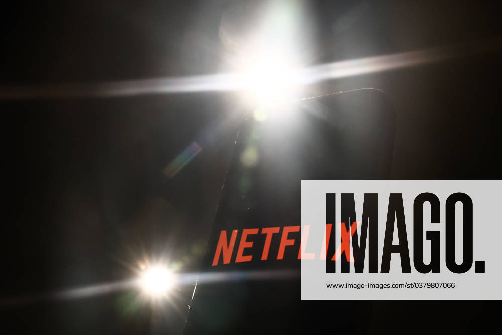 Popular Apps And IT Companies Photo Illustrations Lights and Netflix logo displayed on a phone screen are seen in this illustration photo taken in Krakow, Poland on December 27, 2023. Krakow Poland
