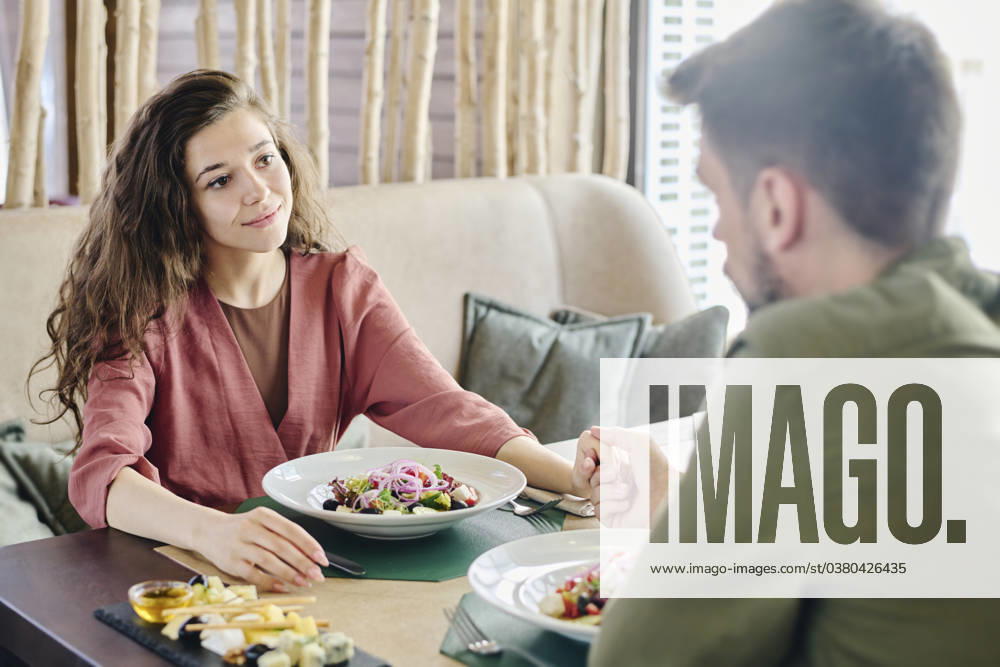Loving couple holding hands and having lunch at restaurant model released, Symbolfoto property released, DSHF01404