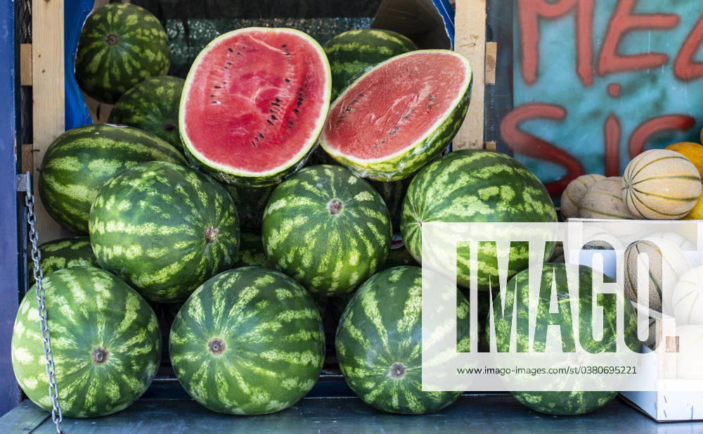Watermelons on shelf. Cutted watermelon on street market Watermelons on shelf. Cutted watermelon on street market. Summer Fruits. ,model released, Symbolfoto