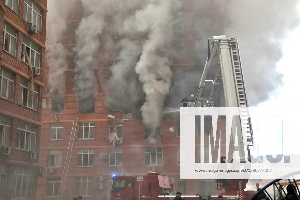 ODESA, UKRAINE - DECEMBER 29, 2023 - Firefighters employ an aerial platform to put out a fire at a residential building affected by the massive Russian missile and drone attack in Odesa, southern Ukraine. Aftermath of Russian missile attack in Odesa