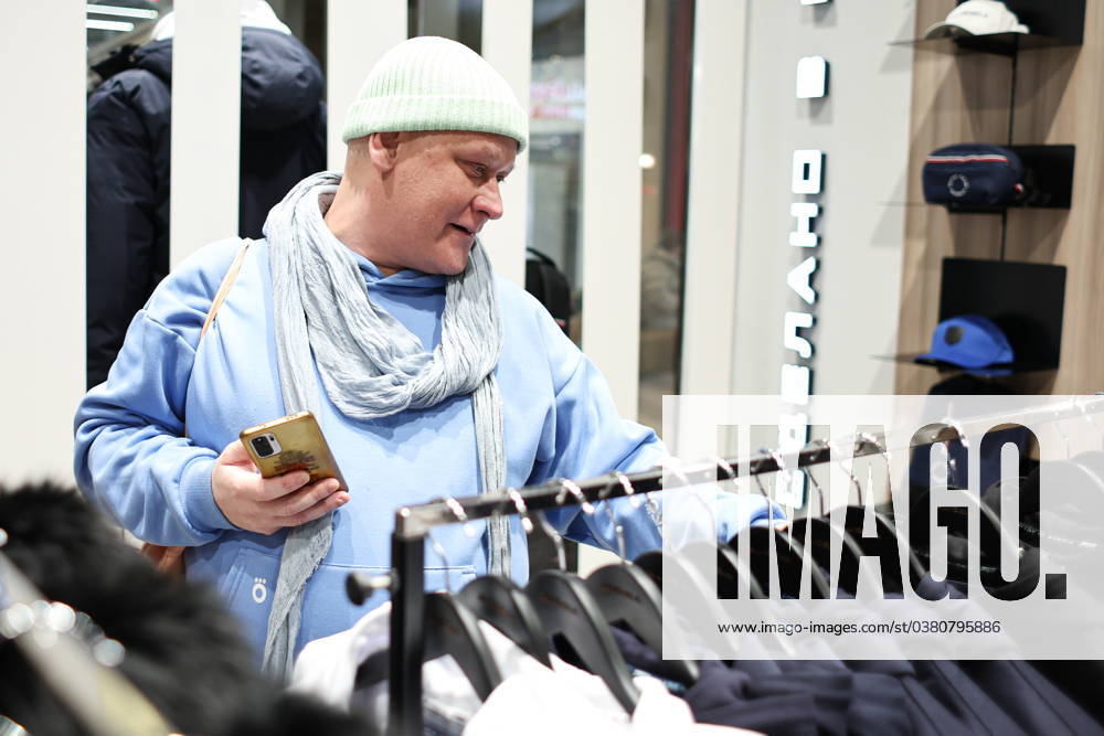 RUSSIA, MOSCOW - DECEMBER 29, 2023: A man visits a Putin Team Russia sportswear store opened at the Paveletskaya Plaza shopping centre. Mikhail Tereshchenko TASS 66098085