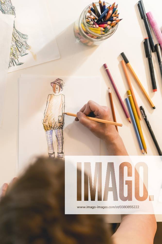 Top view at a Fashion designer, the a Fashion sketch draws vertical Recording