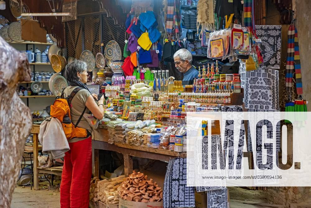 Western Tourist buys Souvenirs at Souk El Henna in the Old Medina the City Fes, Fez, Fez Meknes, Morocco, Africa