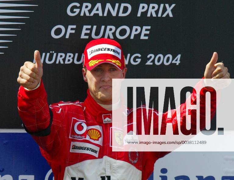 German Formula One driver Michael Schumacher thumbs up during the winner ceremony of the Formula One Grand Prix of Europe at the Nuerburgring circuit western Germany Sunday May 30 2004 Schumacher won ahead of his team mate Barrichello from Brazil and British BAR Honda driver Button Eckehard Schulz NUERBURG DEU