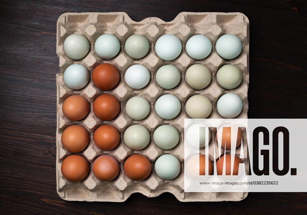 Eggs in tray Fresh organic chicken eggs in cartons tray. Flat lay.