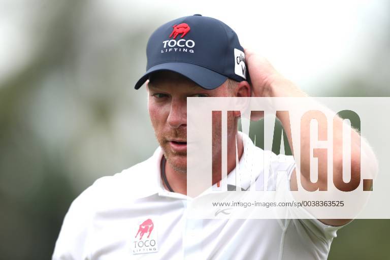 Singapore - Shaun Norris of South Africa adjusts his hat on the 9th hole during the second round of the Singapore Open at the Serapong Course, Sentosa Golf Club. Golf 2019: Singapore Open: Second Round - ZUMAm170 20190118_zap_m170_028