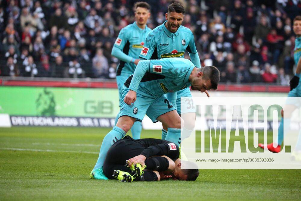 Jerome Gondorf SC Freiburg and Vincenzo Grifo SC Freiburg scream at the grounded Filip Kostic Frankfurt because they suspect a spectacle at the match Eintracht Frankfurt vs. SC Freiburg in the 1 Soccer Bundesliga on 19 01 2019 DFL REGULATIONS PROHIBIT ANY USE OF PHOTOGRAPHS AS IMAGE SEQUENCES AND OR QUASI VIDEO Eintracht Frankfurt vs SC Freiburg Soccer 1 Bundesliga 19 01 2019 Frankfurt