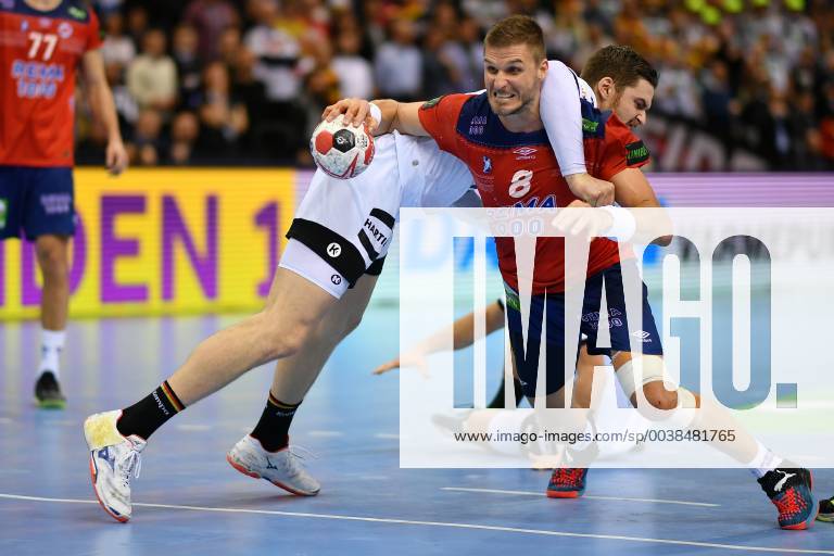 (190126) -- HAMBURG, Jan. 26, 2019 -- Hendrik Pekeler of Germany (L) vies with Bjarte Myrhol of Norway during the IHF Men s Handball World Championship WM Weltmeisterschaft semifinals between Germany and Norway in Hamburg, Germany, on Jan. 25, 2019. Norway won 31-25. ) (SP)GERMANY-HAMBURG-MEN S HANDBALL-WORLD CHAMPIONSHIP-SEMIFINAL UlrichxHufnagel