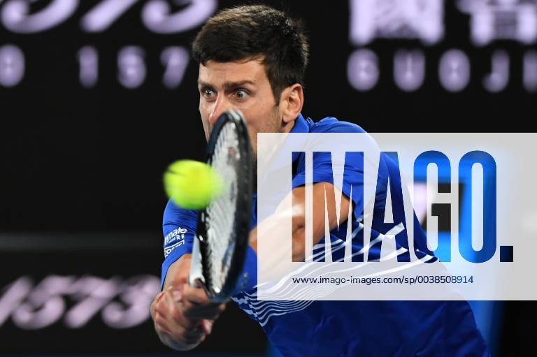 (190127) -- MELBOURNE, Jan. 27, 2019 -- Novak Djokovic of Serbia hits a return the men s singles final match between Novak Djokovic of Serbia and Rafael Nadal of Spain at 2019 Australian Open in Melbourne, Australia, Jan. 27, 2019. Lui Siu Wai) (SP)AUSTRALIA-MELBOURNE-TENNIS-AUSTRALIAN OPEN-DAY 14 lvxiaowei