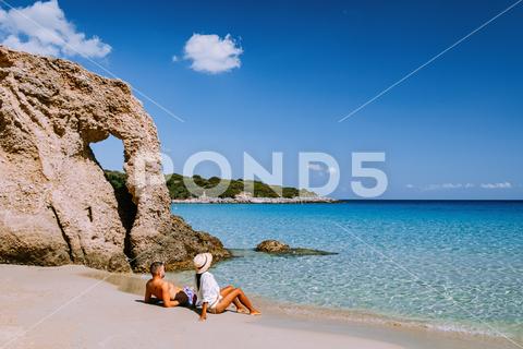 Tropical beach of Voulisma beach, Istron, Crete, Greece,Most beautiful beaches of Crete island -Istron bay near Agios Nikolaos young couple mid age on vacation in Greece Crete voulisma beach couple vacation mediterranean crete greece beach tropical greece beach istron bay holiday blue lagoon ocean coastline paradise beach picturesque travel greek beach summer vacation agios nikolaos blue sea seascape peace tropic blue sand sandy beach bay sea paradise coast relaxation relax island sky istron voulisma wave turquoise swimming peaceful scenery white mid age diversity luxury men woman
