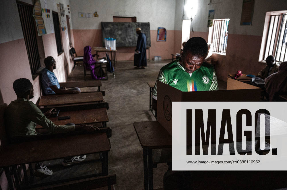 (240114) -- MITSUDJE, Jan. 14, 2024 -- A man votes at a polling station in Mitsudje, Comoros, Jan. 14, 2024. Comoros kicked off its first round of the presidential election on Sunday to select the national leader from among six candidates, including incumbent President Azali Assoumani, for the next five years. ) COMOROS-PRESIDENTIAL ELECTION-VOTING-START WangxGuansen